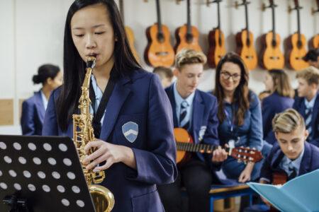 Music education - a pupil learning the saxophone